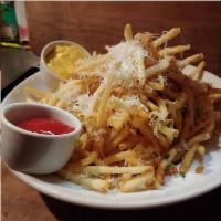 Truffle Fries · Shoe string potatoes tossed with truffle infused oil, fin herbs, pecorino-romano, house-made...