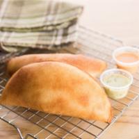 Ground Beef Empanadas · One 5 oz. mouth-watering deep-fried empanada made of corn flour filled with ground beef.