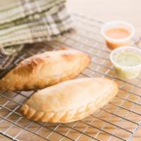 4 Units Shredded Chicken Baked Empanadas · 4 baked empanadas made of wheat flour filled with delicious shredded chicken. Ideal for brea...