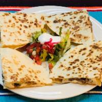 Quesadilla · Flour  tortillas with house cheese blend served with lettuce, guacamole, VT Cabot sour cream...