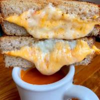 Grilled Cheese Tomato Soup combo · Cheddar/ricotta/garlic herb butter/toasted levain/ comes with a cup of tomato soup