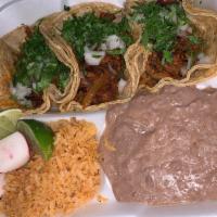 Taco Dinner · 3 tacos of your choice served with rice and beans

