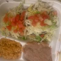 Sopes Dinner · 2 sopes with your choice of meat served with rice and beans on the side
