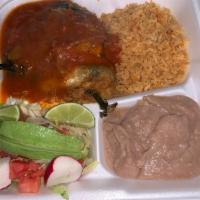 Chiles Rellenos · 2 poblano peppers filled with cheese served with rice,beans and salad. ranchero sauce pour o...