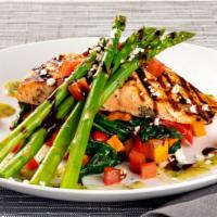 Grilled Salmon Fresca* · Grilled salmon, asparagus, sweet potatoes, spinach, red peppers, feta, Roma tomatoes, pesto ...