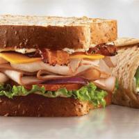 Turkey Club Sandwich · Turkey, bacon, cheese and three toppings.
