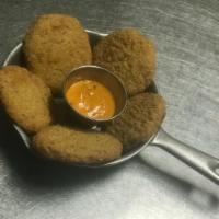 Fried Green Tomatoes · Southern deep-fried tomatoes paired with our signature underground sauce.