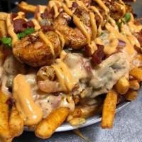 Bayou Fries · Seasoned french fries topped with our seafood cream sauce, shrimp, provolone cheese, applewo...