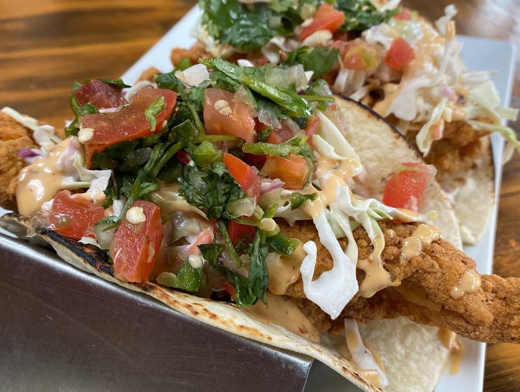 Tam's Tacos · Catfish or shrimp, blackened or fried flour tortilla with coleslaw. Pico de gallo, and our spicy drizzle.