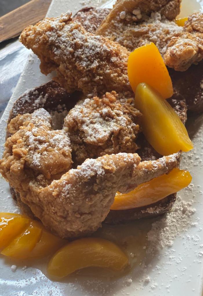 Cast Iron Love Chicken and Peach Cobbler French Toast · 3pcs. of crispy Bayou chicken served with chef tom's award-winning peach cobbler French toast.