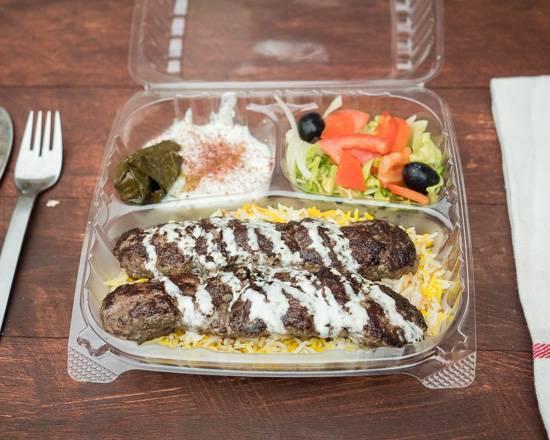 15. Beef Kabab Plate · Rice, beef kabab, salad hummus tzatziki with dolma, optional: hot and garlic sauce.
