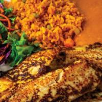 Zarandeado Fish Fillet · Zarandeado fish fillet served with rice beans and salad.
