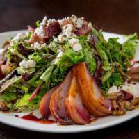 Pere Gorgonzola Salad · Mixed greens, Gorgonzola, and fresh pears in red wine dressing.