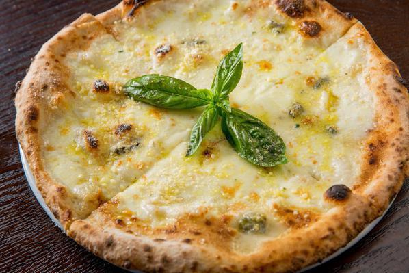 Quattro Formaggi Pizza · Homemade fresh mozzarella, Parmigiano Reggiano, Pecorino Romano, fontina and Gorgonzola cheese and extra virgin olive oil. Individual 12