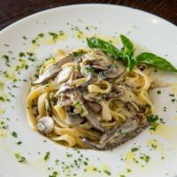 Fettuccini Funghi · Mixed mushrooms and creamy garlic sauce.