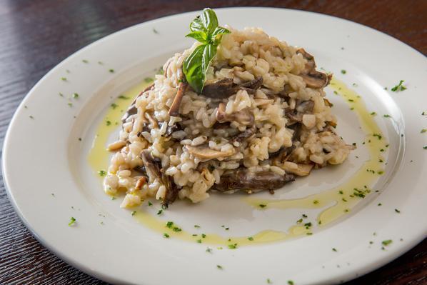 Risotto Funghi · Creamy medley of mushrooms, sherry wine and Parmigiano, finished with truffle oil.