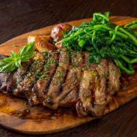 15 oz. Rib-Eye Steak · 15 oz. seasoned grilled rib eye finished with olive oil and sea salt. Served with veggies an...