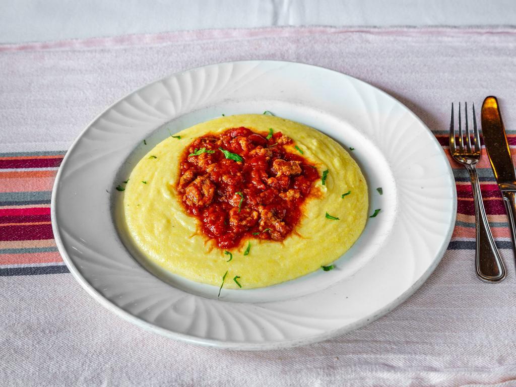 Polenta Salsiccia · Soft polenta with sausage ragu.