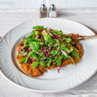 Milanese Capricciosa · Thinly pounded breaded veal chop with tricolor salad.