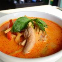 103. Red Curry · Choice of meat with red curry paste, bamboo shoot, thai basil, bell pepper in coconut milk. ...