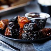 Caramelized Burnt Ends · Tender, bite-sized pieces of hickory-smoked Texas brisket ends grilled to perfection with ou...