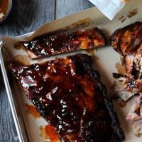 Half Slab Ribs · Meaty St. Louis-style ribs, smoked low & slow for 4-5 hours, with two Southern Sides. Add a ...