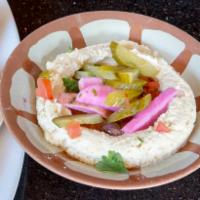 Hummus with Pita Bread · Dip made from chickpeas. Extra side of pita for an extra charge.