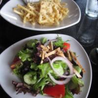 House Salad · Mixed greens, cherry tomato, cucumber, red onion, and pita shoestring tossed in a Meyer-lemo...