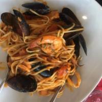 Seafood Linguini · Linguini pasta with calamari, salmon, shrimp, halibut, and mussels.
