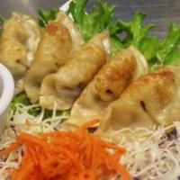 4. Pot Stickers Pan Fried · 5 pieces. Wonton wrappers filled with chicken and vegetables.