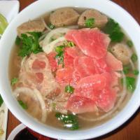 29. Beef Meatball Noodle · Special beef or chicken soup cooked from bone with rice noodle, cilantro, onion and your cho...