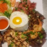 54. Combination Rice Special Platter · Grilled shrimp, pork, chicken, beef, pork chops and pan-fried egg.