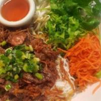 65. Grilled Pork and Egg Roll Vermicelli · Thin rice noodles with fresh lettuce, cucumber, bean sprouts, crushed peanuts, shredded carr...