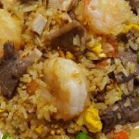 88. Combination Fried Rice · Fried rice with egg, onions, carrots, peas and your choice of meat. Shrimp, Beef, Chicken, P...