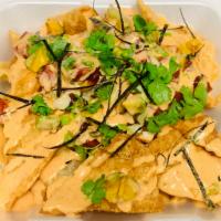 Ahi Tuna Nachos · Wonton Chips, Ahi Tuna, Avocado, Green Onions, Cilantro, Seaweed Flakes, Unagi Sauce, Yum Yu...