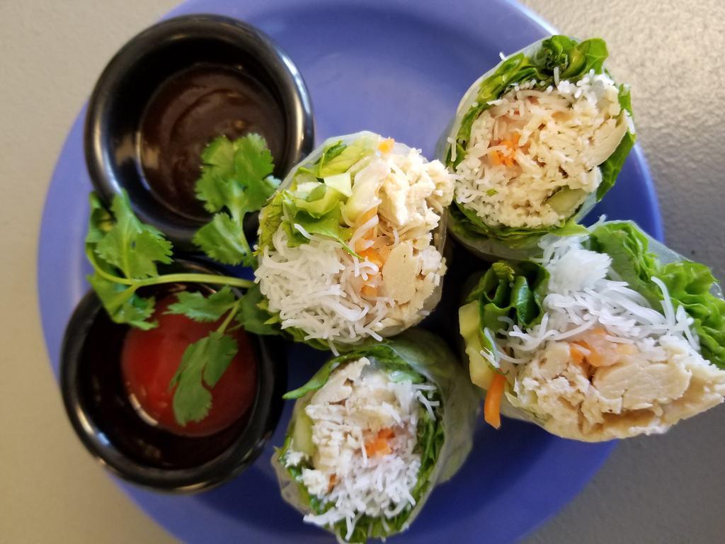 Fresh Spring Roll · Shredded braised chicken in a tom yum broth, rice noodles, pickled root vegetables, cabbage, cucumber, mints, cilantro and green leaf, tucked in rice paper and served with plum peanut sauce.
