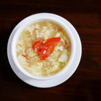 Tomato Egg Soup · Egg flower soup with diced tomato.