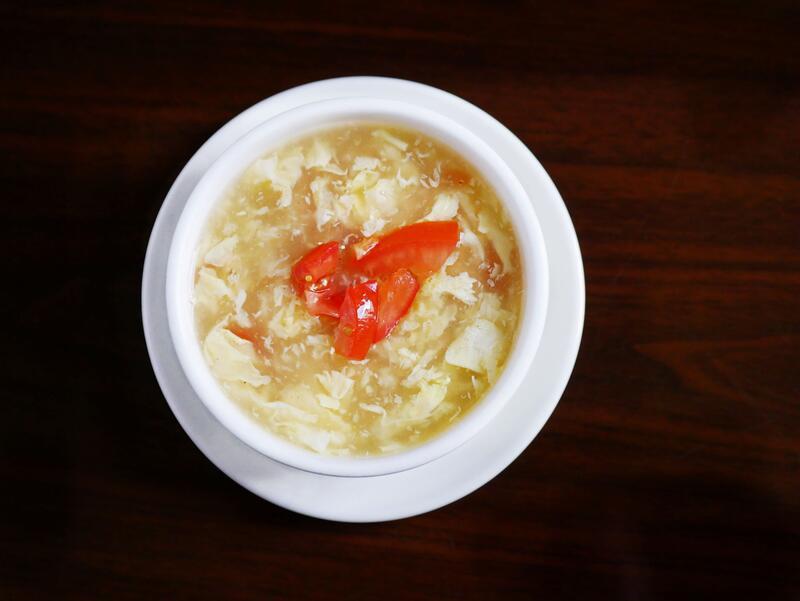 Tomato Egg Soup · Egg flower soup with diced tomato.