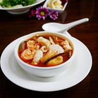 Kimchee Seafood Soup · Various seafood, onion, tofu and bell pepper in Korean kimchee based soup.