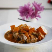 Massaman Beef · Beef chunk, potato and peanut in a rich and mild spicy massaman sauce.