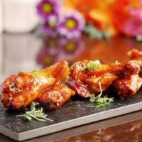 Korean Chicken Wing · Deep-fried chicken wing with homemade Korean spicy sauce.