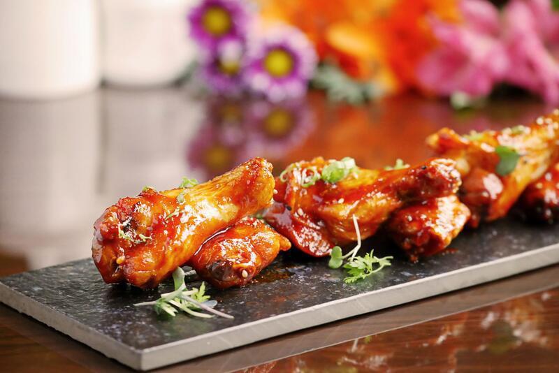Korean Chicken Wing · Deep-fried chicken wing with homemade Korean spicy sauce.