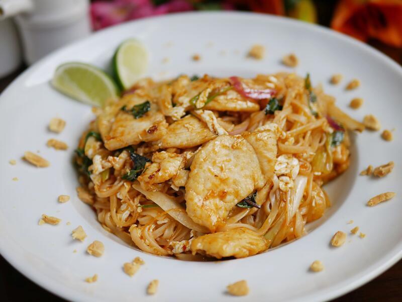 Pad Thai  · Flat rice noodles, egg, onion, scallion and basil stir-fried with a sweet and spicy Thai sauce. Served with Iime and crushed peanuts. Choice of vegetable, chicken, beef, shrimp, or combo.