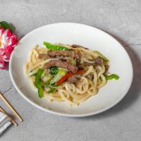 Yaki Udon · Stir-fried thick udon noodles in sweet oyster sauce, with onion, scallion, bell pepper, aspa...