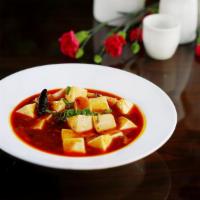 Ma Po Tofu · Soft tofu cubes in a Sichuan style hot and spicy sauce.