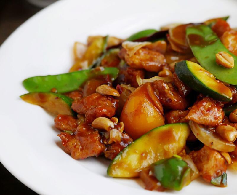 Kung Pao Chicken · Diced chicken breast, peanuts, onions, bell pepper and snow peas in classic spicy kung pao sauce.