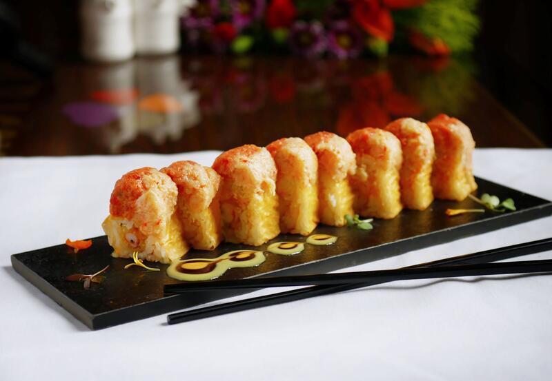 Sunrise Roll  · Tempura shrimp, avocado, cucumber and spicy crab meat, topped with spicy tuna, crawfish salad, served with spicy mayo and honey wasabi eel sauce.