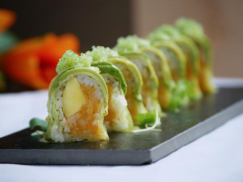 Wasabi Roll · Crunchy spicy scallop and mango rolled with nori seaweed, topped with avocado and wasabi tobiko.