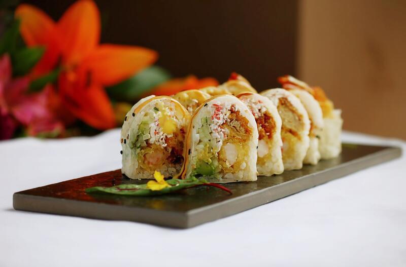 Lion Roll  · 10 pieces. Soft shell crab, shrimp tempura, avocado, cucumber and crab salad wrapped in sesame soy paper, topped with eel sauce, spicy mayo and mango sauce.