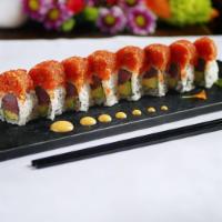 Dragon Roll · Inside:tempura shrimp, avocado and cucumber, outside:eel and masago, sauce: eel sauce.
